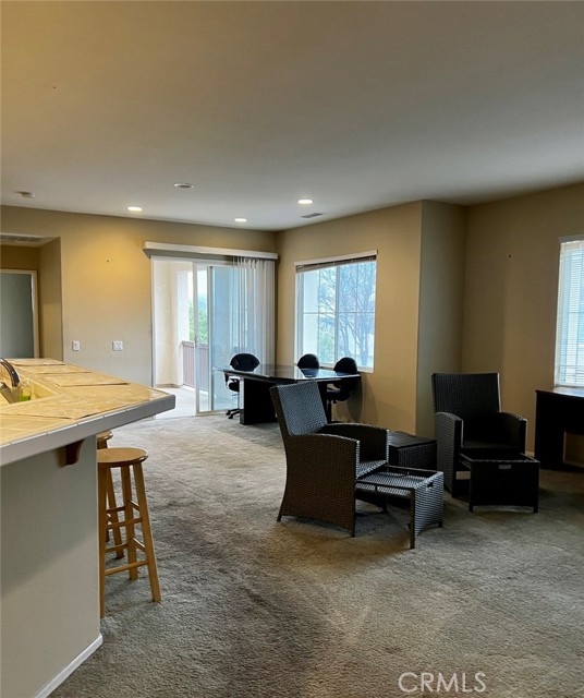 Spacious living room with slider to balcony.