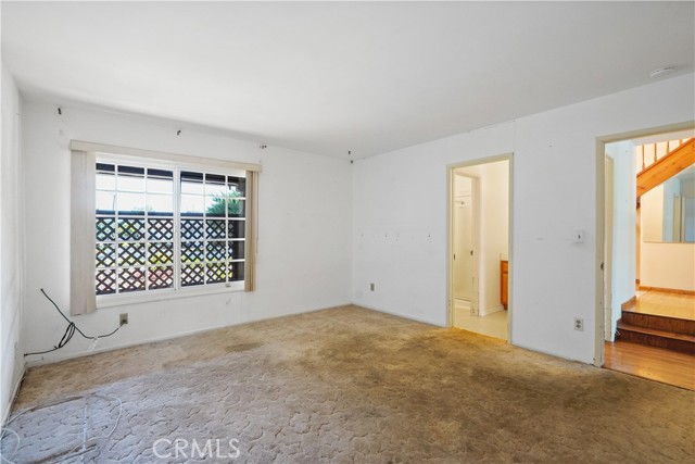 Downstairs primary bedroom suite with attached bathroom with a shower