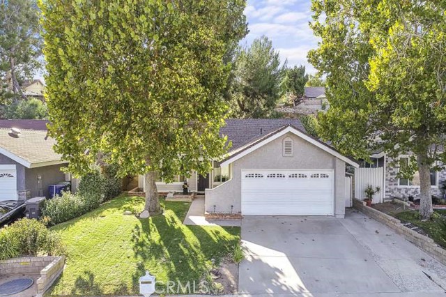 27629 Sequoia Glen Drive Valencia, California This lovely single story home is located in a great Valencia neighborhood! One of the rare areas in Santa Clarita that has NO mello-roos and NO HOA!! When you walk in you will be welcomed with a spacious living room with newer windows and lots of natural light. This home is very cozy and features 3 bedrooms and 2 bathrooms. The back yard has a covered patio and great potential and includes an enclosed room with lots of possibilities. The attached garage has plenty of space and a laundry area. Come take a look make this home!