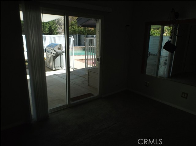 View of sliding door in master bedroom leading to patio.