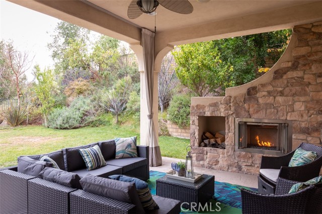 Covered Patio area with custom fireplace