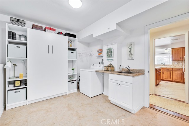 Over-Sized Laundry/Storage room with Murphy Bed.