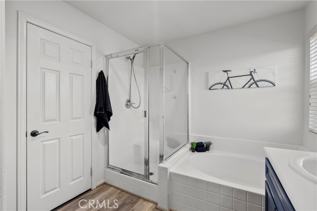 Master bathroom with separate shower and soaking tub.