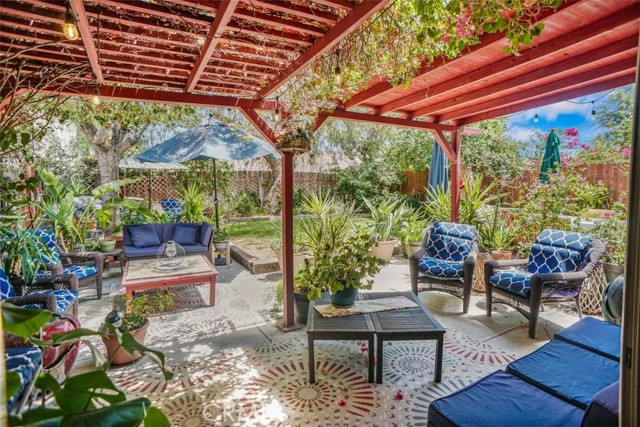 beautiful backyard with wood patio cover.