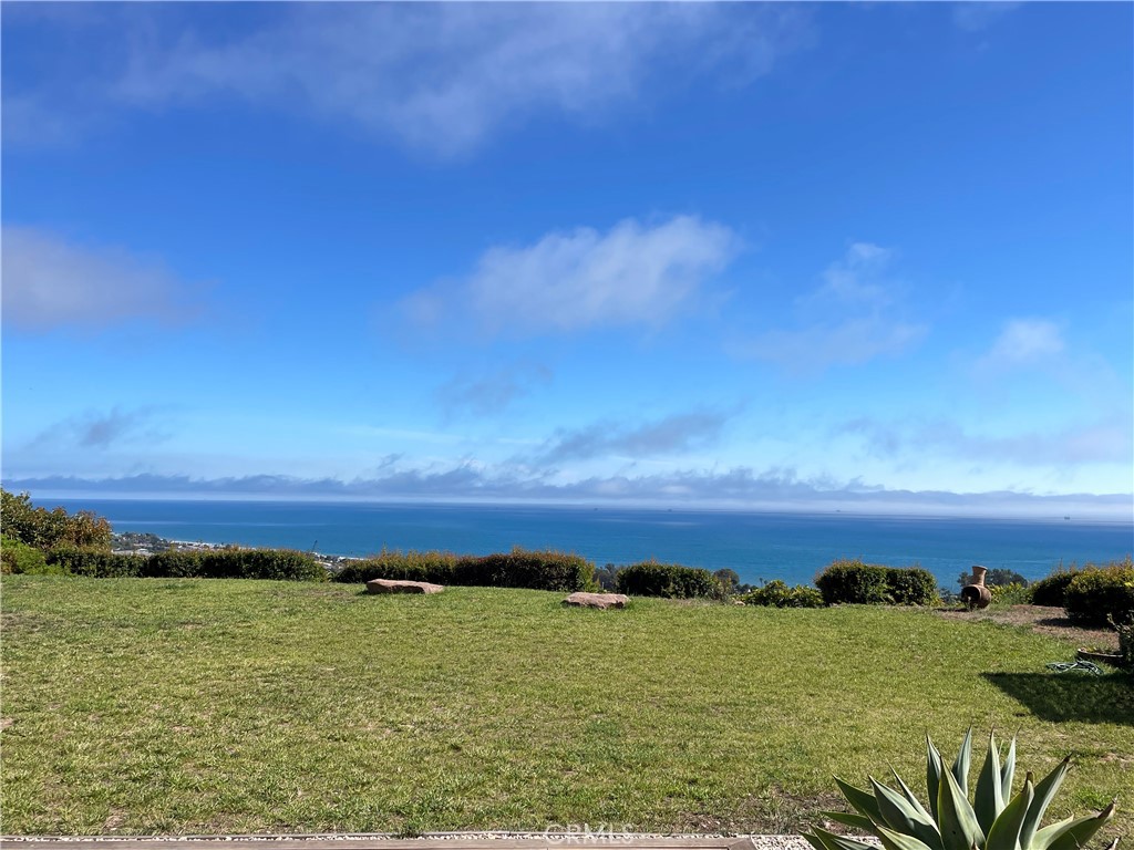 3350 Foothill Road Carpinteria, California Nestled on 15 acres in Carpinteria at the foothills of Los Padres National Forest. A gated entry welcomes and winds you above the beautiful Pacific coastline to the top of the certified organic avocado farm. This contemporary 3 BR and 2 BA home offers panoramic ocean views of the Santa Barbara coastline and the Channel Islands. Located next to the Santa Barbara Polo fields. The house was designed and constructed for off the grid living and a self-sufficient lifestyle. This one-of-a-kind single level property features wide ocean views from the living room, bedrooms, bathroom, and the kitchen. A triple panel sliding glass door invites you to a stunning living room featuring travertine floors with an open floor plan and seamless indoor-outdoor lifestyle. Master suite and secondary bedroom opens via glass doorways onto the 1000SF IPE deck that stretches the length of the home. The gourmet kitchen features Wolf stove and other high-end appliances with Dolomite wall and countertop. All bedrooms feature acacia hardwood floors and bathrooms have wall mirrors and Carrara Marble. The house features tall ceilings and plenty of ocean and mountain views. A walkway leads you to a separate meditation room with a private deck overlooking the Santa Barbara coastline. You can watch magnificent sunsets or watch a weekend polo match. This is an amazing property surrounded by 250 avocado trees, 100 dragon fruit plants, and dozens of mature fruit and tropical trees. A new irrigation system has been installed for the whole orchard. There are terrace gardens with rock walls that lead to fenced orchards and butterfly gardens. Enjoy incredible sunrise and sunsets all throughout the property. It is a magical place that inspires you and reconnects you to nature. Potential for ADU and Tax Incentive under Williamson Act. Sited for maximum privacy yet located just minutes from trails, beaches, and all the amenities of Santa Barbara, Summerland and Montecito.