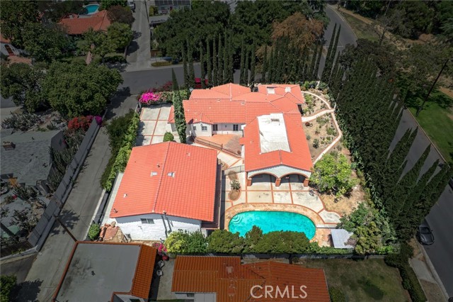 Aerial View of This Approximate 3,000 Square Foot Home on Nearly 1/3 Acre With An Apartment (ADU), 2 Bay Garage and Swimming Pool