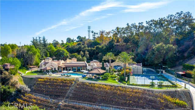 16405 Mulholland Drive Los Angeles, California A one of a kind Richard Landry single story villa perched atop a completely private 7 acre estate with stunning 180° views. This exquisite resort estate features a salt water pool/spa, outdoor BBQ dining area, Tennis/Basketball Court, Koi Pond, and several private hiking trails that encompass the magnificent grounds. Just beyond the pool an award winning vineyard is set on the lush hillside producing Cabernet Sauvignon , Merlot, and Viognier. The home boasts a custom built professional screening room, self sustaining energy features, custom finishes ,high ceilings, bright interiors engulfed with natural light, and large windows providing incredible unobstructed views!
