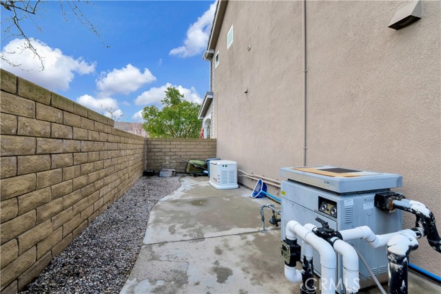 Side yard with pool equipment and generator