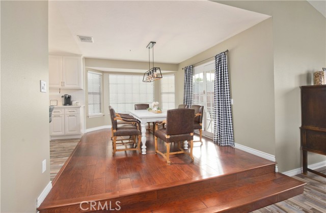 Dining area with access to rear courtyard with covered seating area.