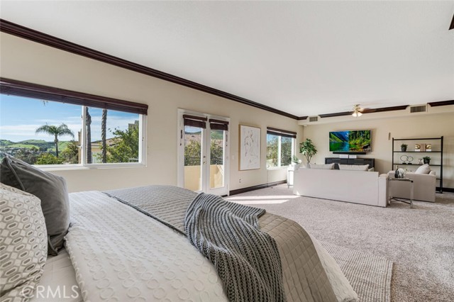 View of bedroom space and balcony entrance