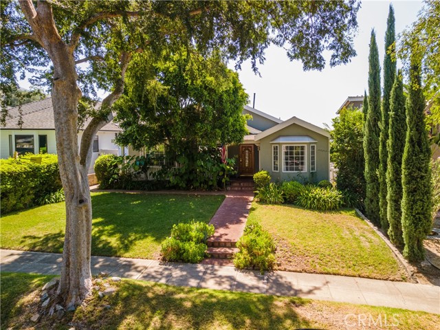 **MOTIVATED SELLERS!!** Beautiful single story home on one of the most prestigious streets in Burbank! This home is 3 bedrooms, 3 bathrooms (2 full baths and 1 half bath), 2,508 square feet on a 8,353 square foot beautifully landscaped lot. Large and private front porch to enjoy the quite neighborhood and amazing tree lined views. Formal living room with fireplace, high ceilings and beautiful wood beam. The living room is open to the open dining room with bay window, arched doorways, original hard wood floors and perfect for hosting family dinners. Dining room leads to the wide open kitchen with island, built-in wine rack, bar/breakfast area and tile floors. The office area has a built-in desk and plenty of storage. The kitchen opens to the spacious family room with an additional fireplace and half bath. The family room faces the French double doors leading to the patio area and backyard which is perfect for entertaining. Master/Primary room is set back away from the other bedrooms. It's bright with lots of natural light, hardwood floors, large walk-in closet, French double doors leading to a private back deck with views of the backyard. Large master/primary bathroom, soaking tub, separate shower and privacy windows. The middle bedroom has a large closet with plenty of storage room, natural lighting and hardwood floors. In the hallway before the front bedroom is the full bathroom with soaking tub, stand up shower and privacy windows. Front bedroom has walk-in closet and bay window with beautiful view of the landscape and tree lined street. Backyard is perfect for entertaining with plenty of seating areas, full grown fruit tree, paved and grass areas, 2-3 additional parking spots in rear, not including the detached 2+ car garage with commercial sink and storage cabinets. Perfect for an ADU with alley access and the additional parking available. The structure was built for a 2 story home even though it's a single story. Close to the golf courses, club house, hiking trails, multiple parks, schools, restaurants, town center, Starlight Bowl and much more!!