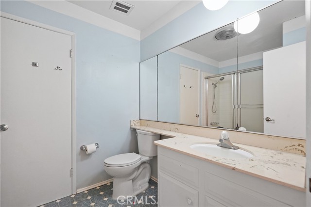 The main full bathroom off  the upstairs hall serves the two other bedrooms and has a tub/shower combo AND a door to the primary suite bthroom that has a shower, vanity & toilet