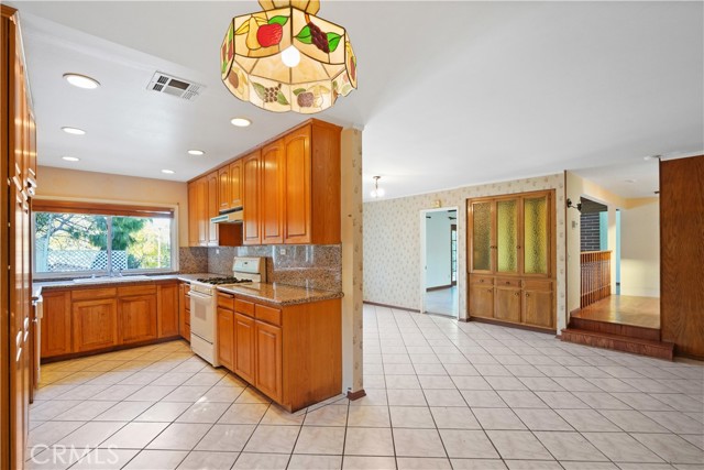 Separate family room or formal dining room next to the dine in kitchen