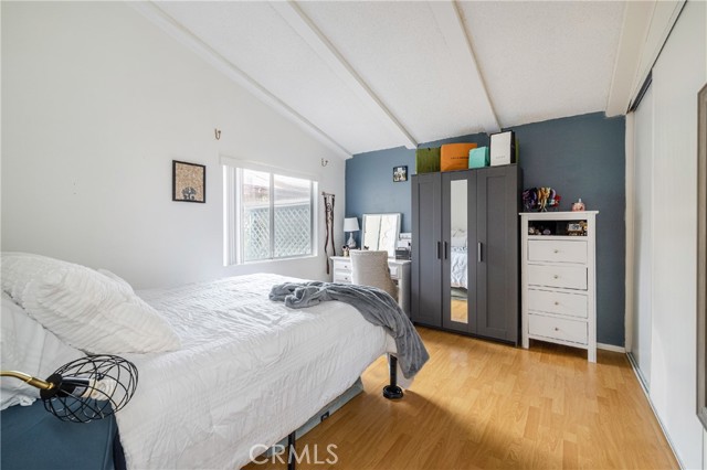 High ceiling, primary bedroom with ample closet space