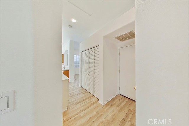 Hallway looking at laundry area/entrance to garage