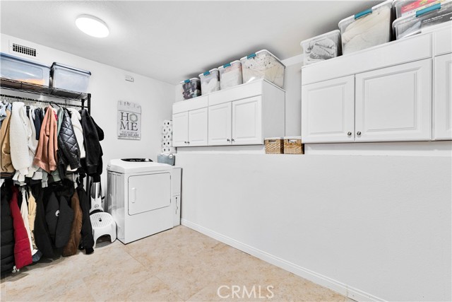 Over-Sized Laundry/Storage room with Murphy Bed.