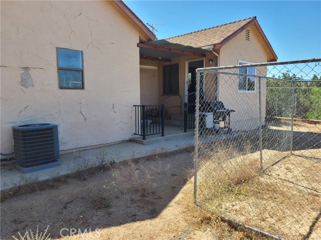 Back door leads to outside laundry area