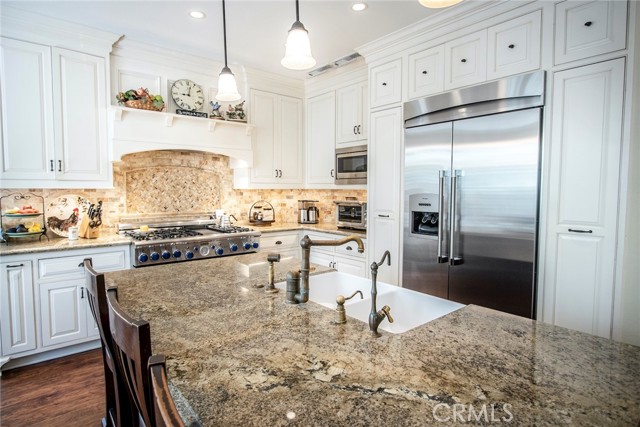 Re-imagined kitchen boasting Alderwood custom cabinetry and gorgeous finishes.