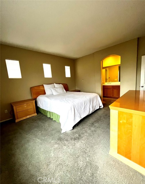 Spacious main bedroom with walk in closet.