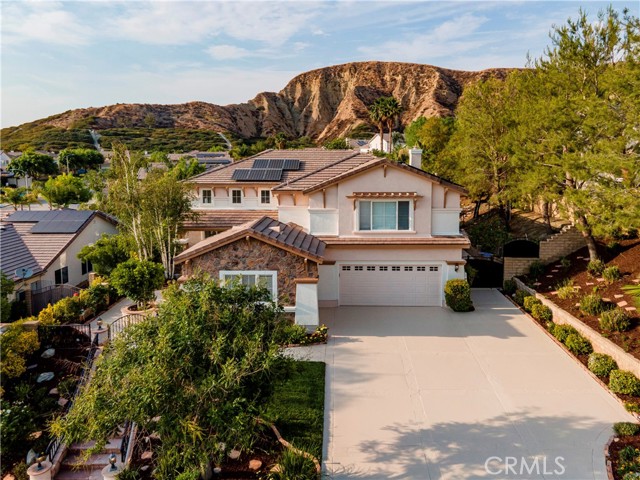 17761 Heron Lane Canyon Country, California Gorgeous Fair Oaks Ranch Pool home with Solar!!! This home has an amazing floor plan and is great for entertaining inside and out, large private backyard with large covered patio, grassy areas, pool with slide and waterfall, spa, BBQ island, and fireplace!! Extra wide driveway and 3 car garage for accommodating all your toys. First floor offers living room , dining room, office with private entry - perfect for those working from home, guest bath, family room, kitchen, laundry room, and additional bedroom suite with private entry for your young adult or mother-in-law. Second story offers full double sink bathroom, 2 bedrooms, huge bonus room and grand master bedroom with mountain views and deck. This home is truly a beauty with brand NEW, NEW, NEW.... interior and exterior paint, rustic engineered hardwood floors throughout, ceiling fans, recessed lights, and lighting, new accent shelving in family room, upgraded master bath counter and frameless shower, and the kitchen with stunning porcelain farm sink and quartz counters!!! And I'll remind you again... paid for solar and tankless waterheater?!?!? Talk about efficiency! Great location! Close to shops and 14 Fwy. Come and See!!