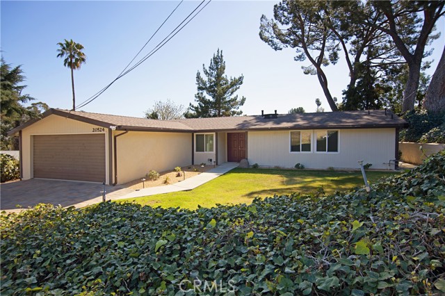 20524 Rhoda Street Woodland Hills, California Double doors open to this fantastic 3 bedroom, 2 bath home that has been beautifully renovated from top to bottom. The open floor plan has vaulted smooth ceilings & neutral wood laminate flooring throughout! Be the first to use this gorgeous kitchen with quartz countertops and stainless steel appliances including a dishwasher, microwave, and convection oven plus a 4 burner gas Viking cooktop! Dine at the breakfast bar or in the formal dining area. Enjoy an open concept floor plan with a kitchen that opens to the living room and dining area both warmed by the fireplace! The primary bedroom has vaulted ceilings, a large closet, and an ensuite bathroom with a marble shower and cabinet with a quartz countertop! The secondary bedrooms have mirrored wardrobes and access to a full bathroom also finished with marble and quartz. Newer roof, paint inside and outside, windows, lighting, walkways, garage floor, driveway, and more! Walls of glass open to a spacious yard with a concrete patio, grassy yard, and beautiful views! Great locations in Woodland Hills. Close to The Village, Pierce College, freeways, and walking distance to Ventura Blvd.