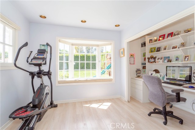 Office space within primary bedroom. Bay windon and built-ins