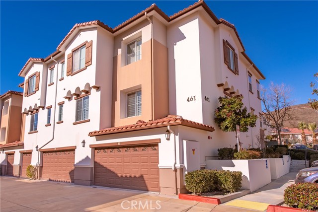 Welcome to this wonderful 2 bedroom, 2 bath home located in the desirable gated Wood Ranch Senior Condominium community! This upper unit is steps away from the elevator.  Step inside to find a large living room with a niche big enough for a 75" TV.  You have the most beautiful views from this unit filled with lots of natural light and a balcony to relax and enjoy the mountains.  Large kitchen opens up to living room and dining area with granite countertops, lots of cabinets, pantry, a two person bar and recessed lighting.  2 large bedrooms and 2 full baths both with granite countertops and grab bars for safety.  Master bath has standing shower with separate tub and dual sinks. Indoor laundry can accomodate full size appliances located in hallway along with a linen closet.  This unit has dual pane windows, a 2 car garage right next to the elevator and a storage area off the garage and close to the mailbox. This gated community has lots of amenities for you to enjoy which include a community pool and spa, recreation room, exercise room, and barbeque area. Refrigerator included is currently located in the garage.