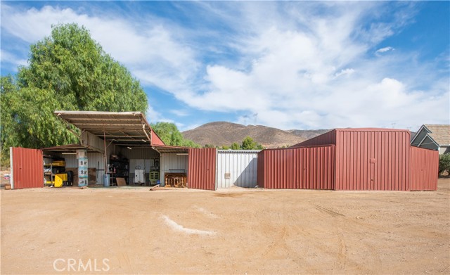 2 deep steel garages 30' x 15' with more storage area in the wings.