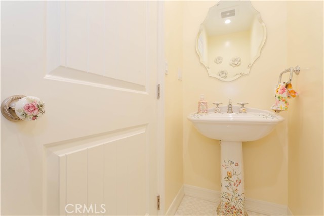 Powder room with artist edition pedestal sink