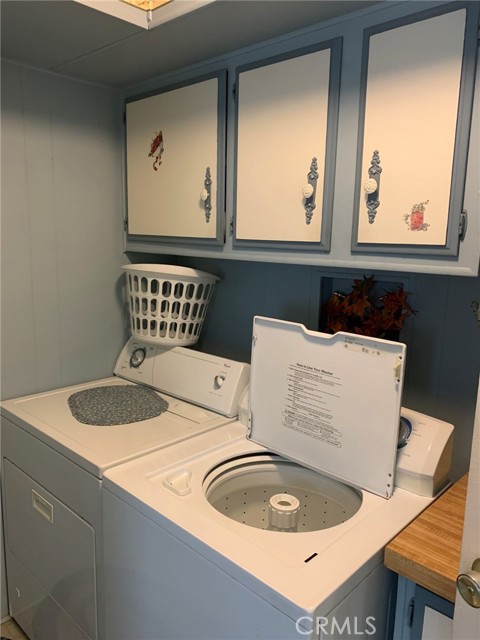 Laundry room next to kitchen