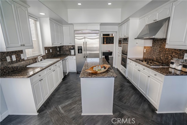 Open Kitchen with Stainless Steel Appliances