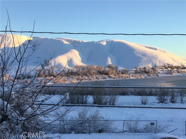 View of Snow on Mountains & Lake