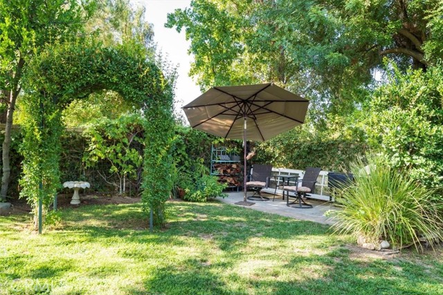 Back corner of yard serves as a BBQ area