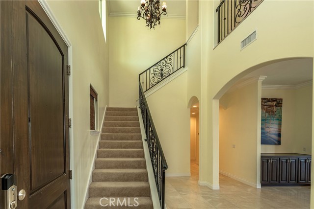 Staircase leading to upstairs master suite & guest bedroom.