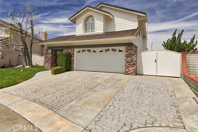 22723 Peach Court Saugus, California Beautiful Mountain View Home in one of the most desirable neighborhoods in Santa Clarita! This home offers vaulted ceilings with accented wood beams in the living room, formal dining room, and kitchen. It has brand new carpet throughout as well as Brazilian Walnut hardwood floors. The dream kitchen has custom cabinetry, top of line appliances which includes a Viking cooktop, Double ovens, Split Dishwasher and a side by side built in Freezer and Refrigerator, all stainless steel, a large and useful island and views of the backyard from the kitchen bay window.
The Family room has a wood/gas fireplace and recessed lighting.
There is a downstairs bedroom with a full bathroom. Upstairs there are two large size guest rooms and a full bathroom. The master retreat is spacious with high ceilings and cedar lined walk-in closet. The master bathroom offers a large deep tub.
The wrap around backyard has an in-ground spa, lush green grounds, covered patios and privacy. Other features include, ceiling fans in all rooms, plantation shutters in all bedrooms, all appliances will stay, including washer and dryer, Possible RV parking, Cul-De-Sac location, excellent schools, park nearby, new exterior paint and a 220V electrical panel. This extraordinary, well-kept, versatile home won't last.