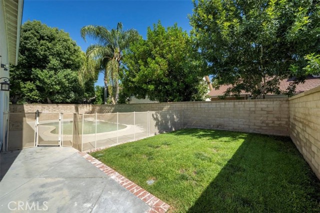 Backyard with Grass area & Fenced Pool