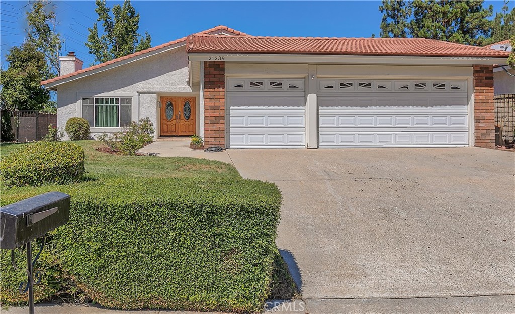 21239 Georgetown Drive Saugus, California Turn-Key beautiful single-level home situated on a 10,000+ square foot corner lot on a cul-de-sac. As you enter into this beautiful 4-bedroom, 2-bathroom home ,you walk into a double door entry with wood laminate floorings throughout the home. Kitchen has granite countertops, large peninsula and beautiful white cabinets. The open lay out with high ceilings offers living room, dinning room and family room. The sliding doors leads out to the low maintenance backyard. The large primary bedroom offers a walk-in closet and a separate shower & soaking tub perfect to relax after a long day.
There are 3 other bedrooms, with one currently use as an office/ pool room with direct access to the large three car garage.
The large grassy front yard and the red roof tiles gives a nice curb appeal that matches the rest of the Sutter Point neighborhood.
HOA provides tennis and other sports courts. This home is convientely located with in walking distace to Starbucks, supermarket, pharmacy, restaurants and schools. Attend the Open houses or schedule your private tour soon,