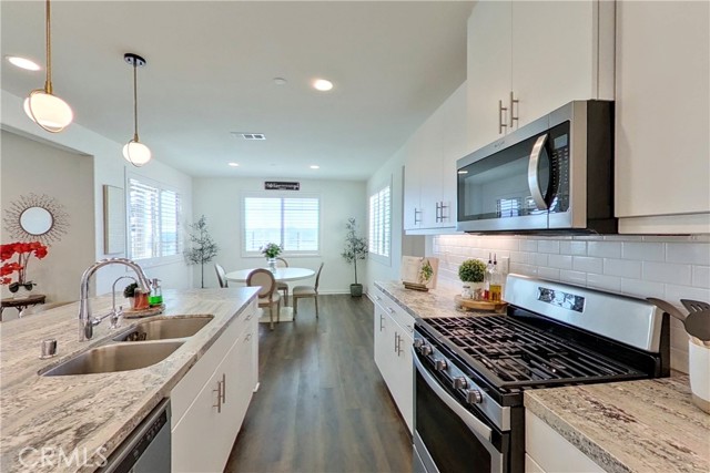 Kitchen with adjacent dining area offers mountain views from every window