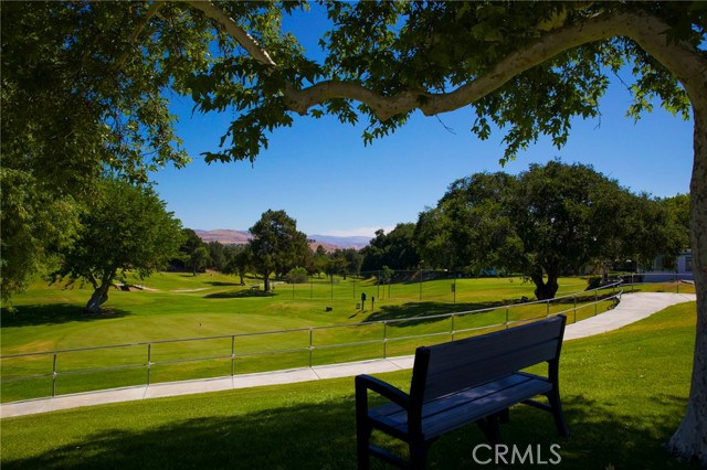 19820 Spanish Oak Drive Newhall, California Welcome to a wonderful Friendly Valley Country Club 55+ community! This 2 bedroom, 2 full bathroom upper level unit offers the most amazing views of the mountains and the valley from your kitchen and the second bedroom windows. If you have been dreaming about a view home, you have just found it! Newer kitchen appliances and carpet, fresh paint with a spacious floor plan that extends out to an enclosed patio for an extra room, you will have plenty of room for entertaining. Unit has two 2 carport spaces with storage. The community offers golf courses, heated pool and spa, card room, billiard room, outdoor cooking area, picnic area, gym are just a few amenities to mention. Guard gated neighborhood has a strict controlled access. You will never want to leave! Unit has two 2 carport spaces.