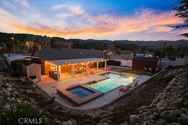 Entertainers backyard with inviting pool and spa