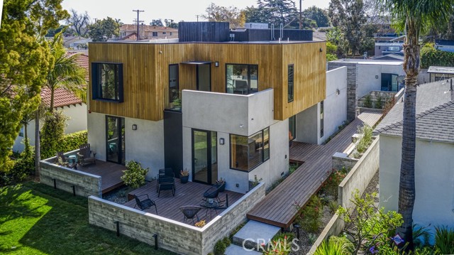 2916 Kansas Avenue Santa Monica, California Welcome to Kansas, an award winning family home on a quiet cul-de-sac in Sunset Park of Santa Monica. Completed in 2020 by Farnsworth Builders and designed by AAHA Studio. “Best of La Cantina 2020” award winner and submitted for the prestigious AIA Award. This contemporary residence is defined by large volumes strategically offset to create entry points, outdoor terraces, and shading throughout the day. A floating full-length boardwalk draws you through to the side/main entrance surrounded by lush new landscaping. The main living space with entertainers kitchen, is anchored by a 22’ wide sliding glass pocket door for that indoor/outdoor living experience. Polished concrete floor runs continuously from the kitchen through the back yard with the door track surgically embedded into the slab. The home is layered with custom fabricated, warm walnut millwork deliberately set against the cool of the poured concrete floors. Wide-plank oak floors provide a tonal contrast at the entry level, upper level bedrooms, staircase and hallways. Oak cabinetry accents in bathrooms offset by full length, gray marble slabs. Ample storage was provided wherever space allowed to ensure that the contents of family life can be tucked away when desired. Detached garage with modern EV charging and alley access, make for a simple ADU conversion if desired. With a fabulous walkable score and close to the trendiest restaurants, shops, parks and freeway access, make Kansas a very attractive purchase.