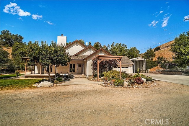 30987 Gilmour Street Castaic, California 3+2+4.21 Acres Single story custom built ! Great room concept! Open floor plan. Wrap around porch. Completely fenced with two gated entries. Public water and natural gas. Also Ranch well! Hard wood floors. Ceiling fans Thur out. milguard windows. Air extrodinaire wood burning fireplace. Granite counters with island. large laundry/craft room. Central vacuum system. Mirrored wardrobe doors. Customs built in desk. Double sinks in master and guest bathroom. Jacuzzi tub in master. Surround sound. Breeze way to oversized two car garage. Rv covered storage 40 ft. Wash rack and shed. 3 24x24 corrals 1 24x 48 arena and round pen area. Many trees including several different pines, oaks and fruits. Grassy area! Very private!