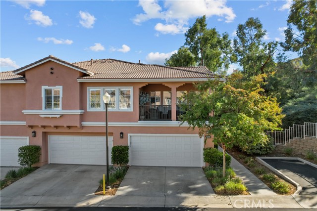 24214 Amaryllis Court Valencia, California Stunning Valencia Cornerstone 2+2, FHA-approved Home with a 2 Car Attached Garage, Open Floor Plan, and No Mello-Roos! The interior highlights include upgraded flooring, upgraded crown molding, and baseboards, new paint, and fixtures throughout, recessed led lighting, surround sound, ceiling fans, shutters, all new switches and outlets, upgraded doors, water softener, and drinking water system. Head up to a flowing open floor plan into the Living room with fireplace, and open to the dining area, which has a slider leading to the balcony. Upgraded kitchen with granite counters, upgraded backsplash, and cabinetry, new range, new faucet, water drinking faucet, new sink, and reverse osmosis system that the buyer would need to set up. Primary suite with custom barn doors, walk-in closet with upgraded lighting, and custom organizers. Upgraded vanity, granite counters, dual sinks, new mirror, and stunning glass-enclosed upgraded shower with chandelier. Secondary bedroom with mirrored closet doors, custom shelving, and upgraded bathroom. 2 Car attached garage that was newly painted, and a new Bluetooth garage door and opener installed, shop lighting, additional electrical outlets, epoxy flooring, storage racks, and cabinets. Association pool, spa, playground, and picnic area. This home is conveniently located near shopping centers, restaurants, award-winning schools, and much much more!!! Don’t miss out on making this your Next Home!!!
