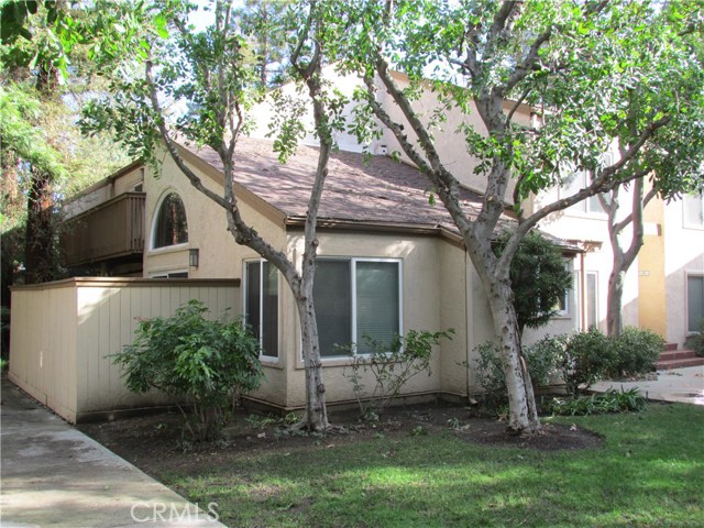 Unit 904 front with private patio to left and dining room windows at center of photo.