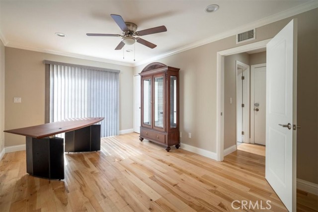 Bedroom Down Stairs Upgraded with Maple wood flooring, recessed lighting, ceiling fan, crown molding & more