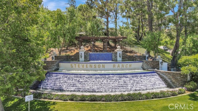 25773 Perlman Place D Stevenson Ranch, California Stevenson Ranch! Once of the best places to live in CA, this completely remodeled two-story Stevenson Ranch townhouse is flooded with plenty of natural sunlight to fully illuminate a well-sized floorplan encapsulates the spacious living room with a cozy fireplace & dining room which leads into the kitchen. Glossy quartz countertops adorn the mocha tone cabinetry of the bright kitchen equipped with built-in stainless-steel appliances & includes a quartz top breakfast bar. Located on the first level, find a convenient power room for guests, laundry room & direct access to the attached 2-car garage. Upstairs, bedrooms offer built-in closets with mirrored sliding doors while a double door entry opens into the primary bedroom featuring an en-suite split bathroom with dual sinks & a walk-in closet. As part of HOA, residents enjoy an onsite park with jungle-gym, shaded patio space & a glittering pool plus a relaxing spa. Only minutes to Pico Canyon Elementary School, Valencia Mall & more!
