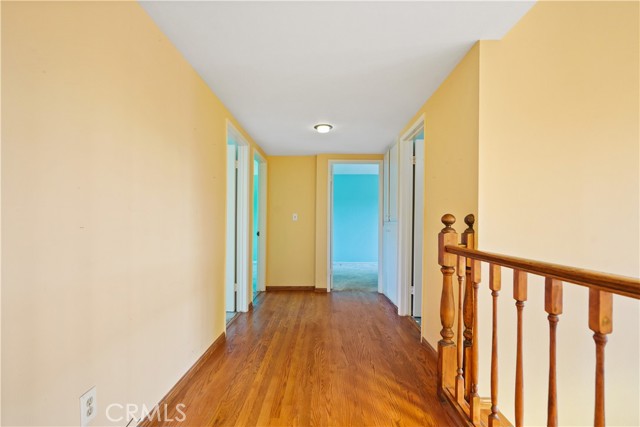 Looking toward the second primary suite. The other two bedrooms are on the left.