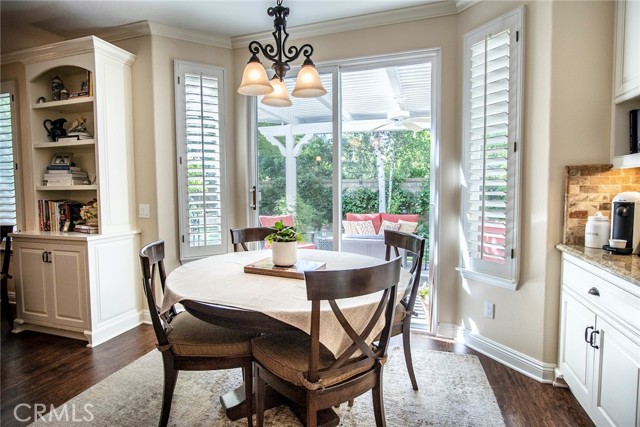 Bright breakfast nook overlooking luscious landscaping.