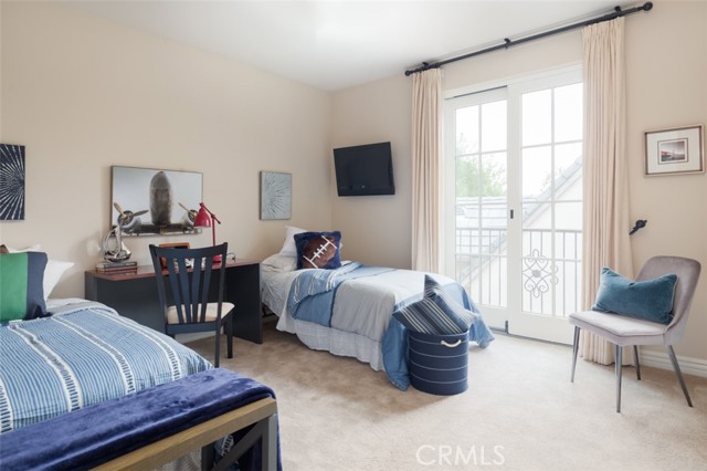 Bedroom 4 with private balcony over courtyard