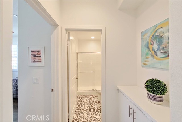 Full bathroom downstairs adjacent to BR #1 with beautiful mosaic floor tile